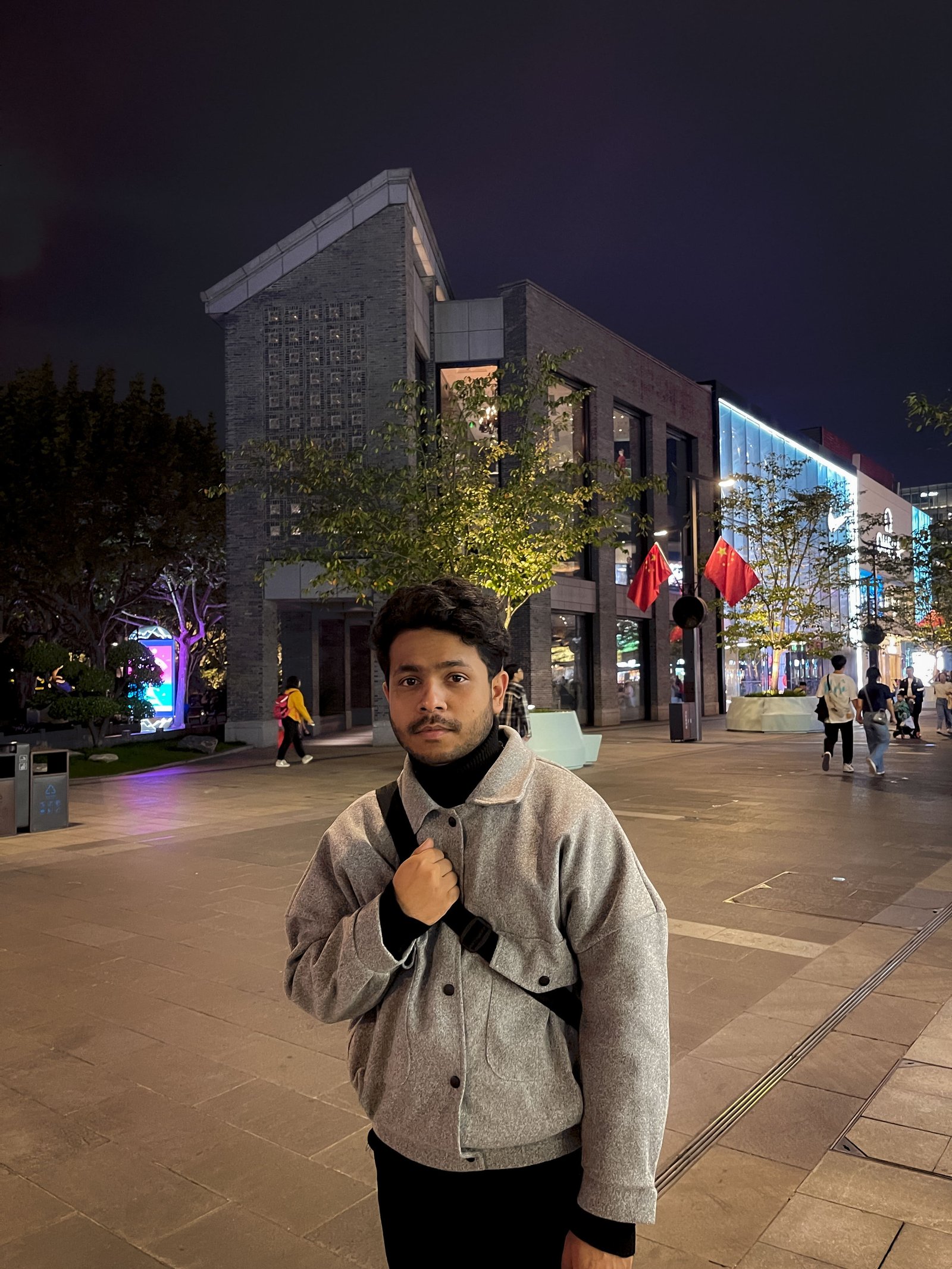 Hasnat Jani Rafin walking outdoors on a university campus